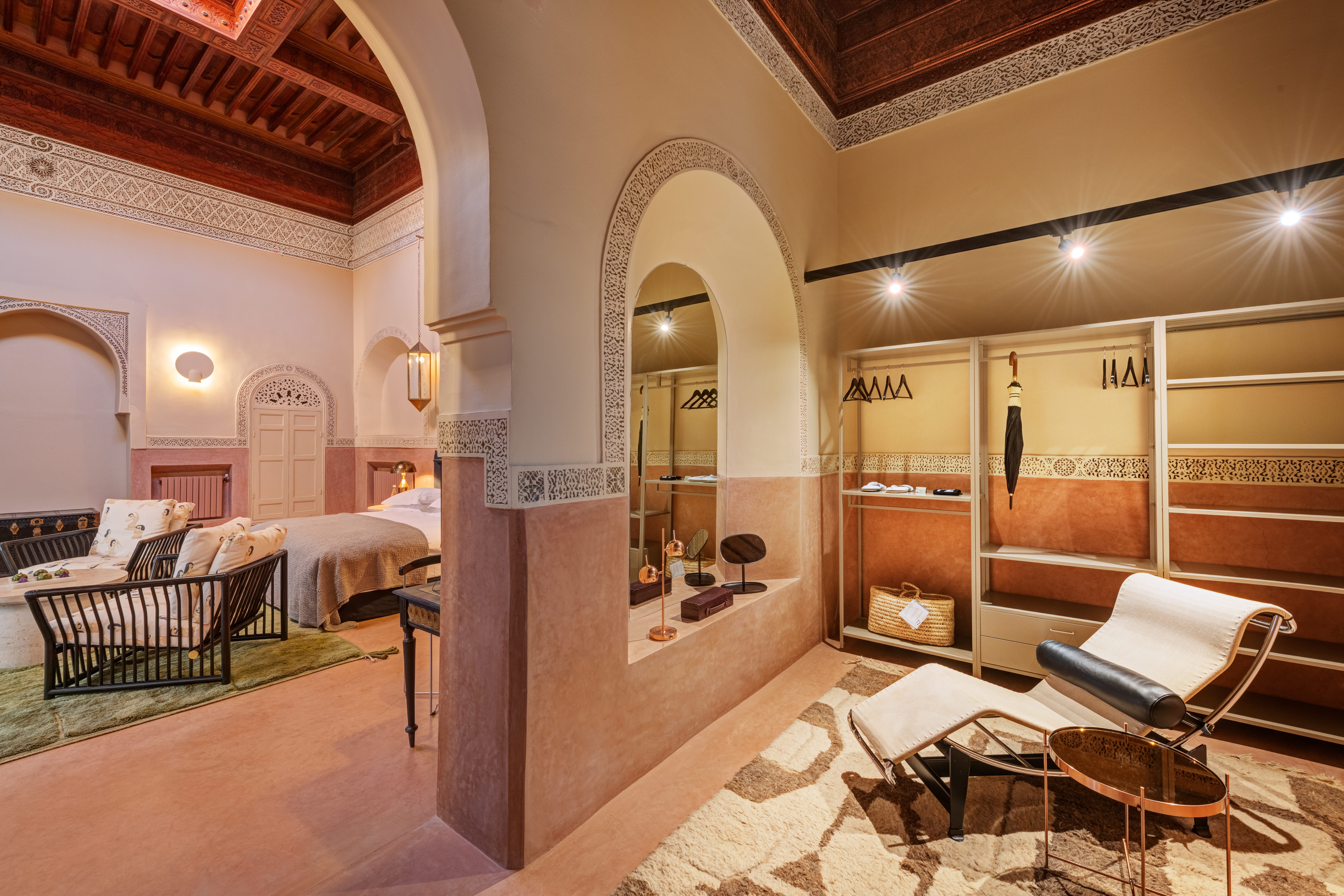 Grand Suite living and dressing space beneath carved plaster and cedar ceilings