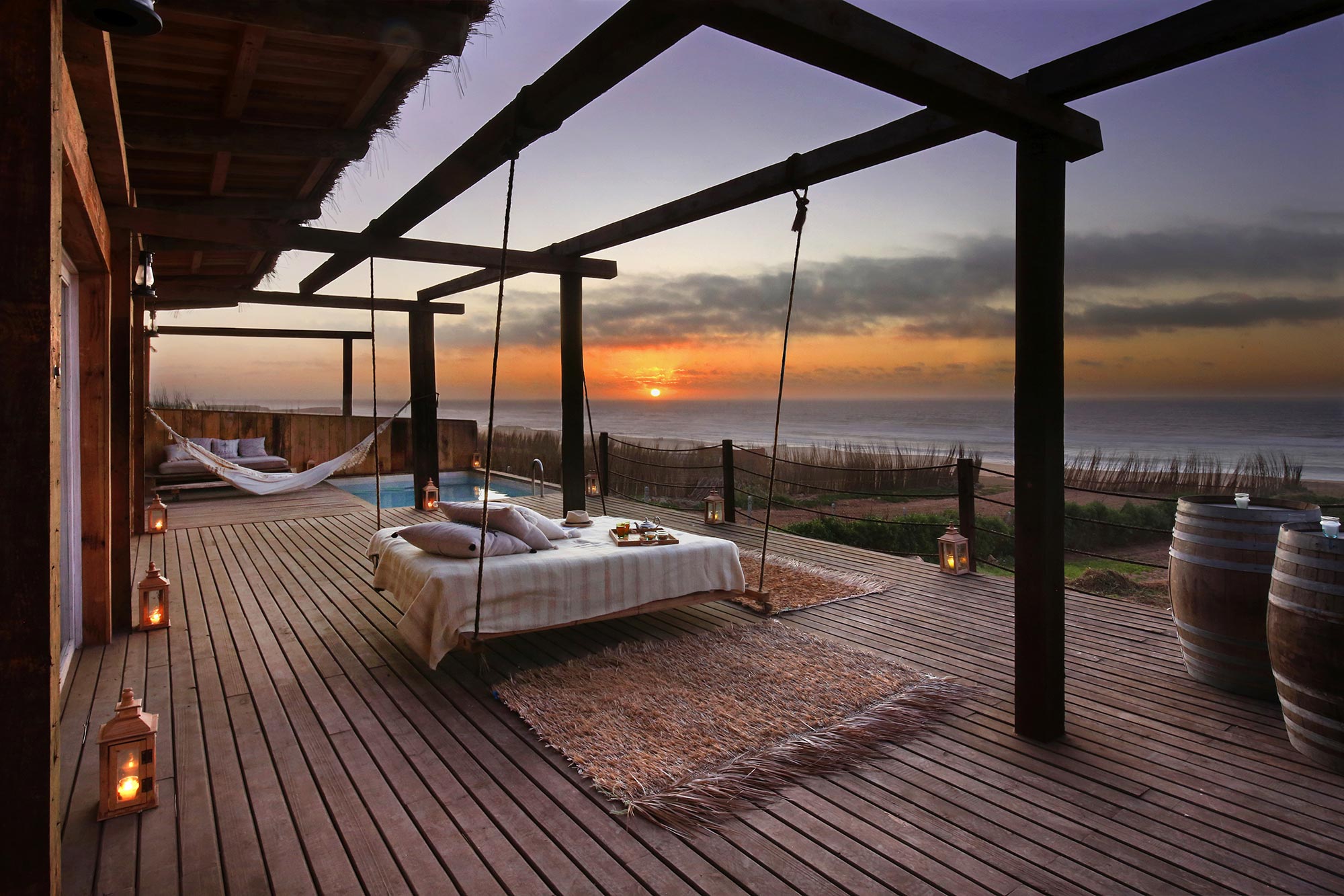 Cabana terrace with suspended daybed, private pool and Atlantic sunset
