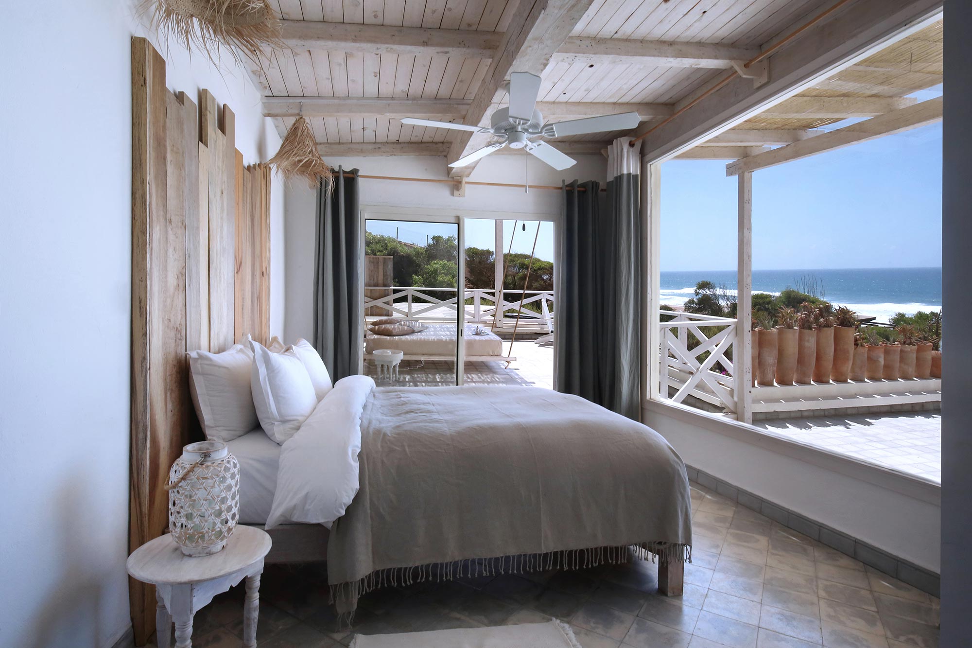 Whitewashed ocean-view suite with a wide private terrace