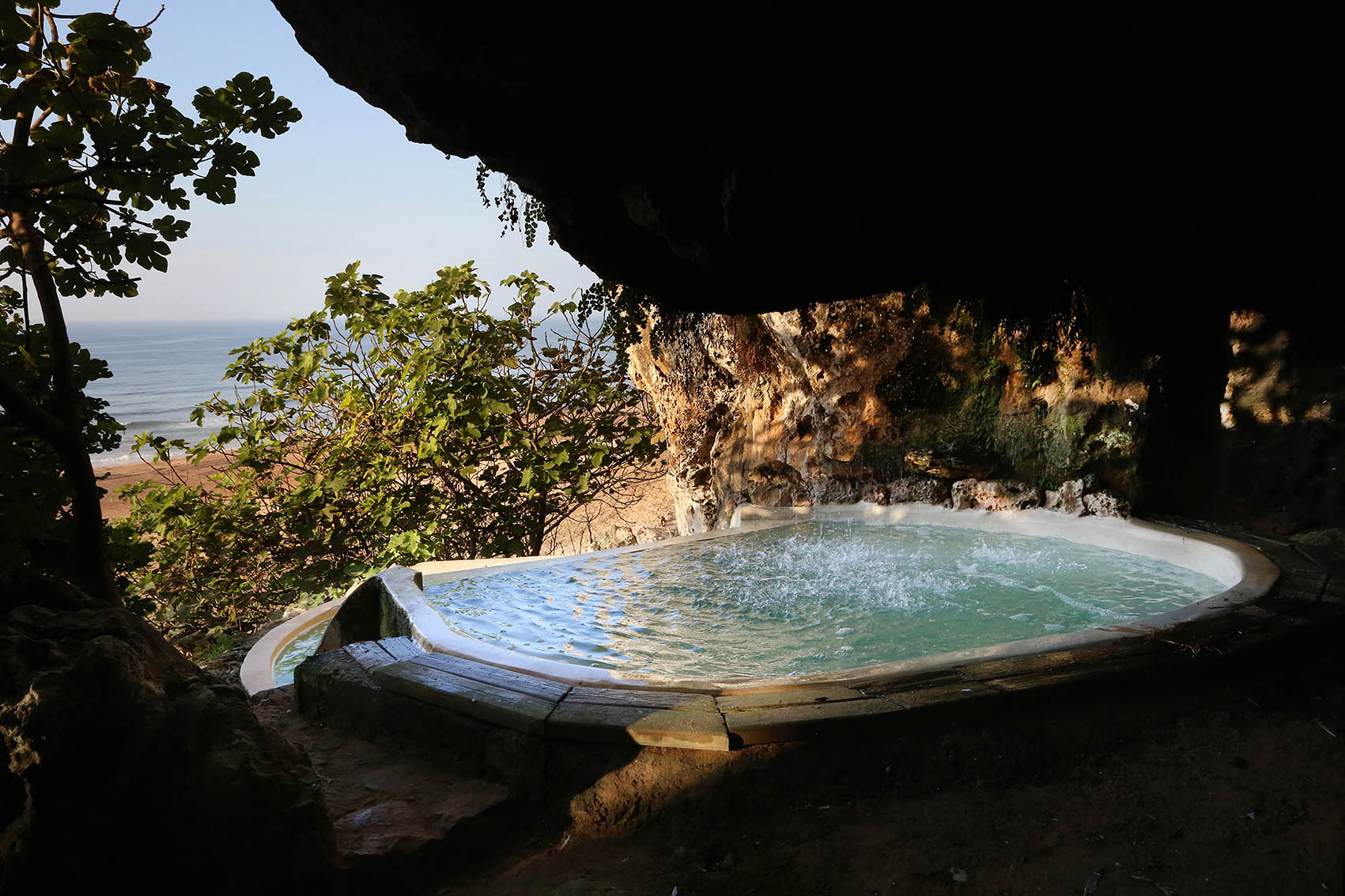 Small grotto pool overlooking the wild beach and Atlantic Ocean