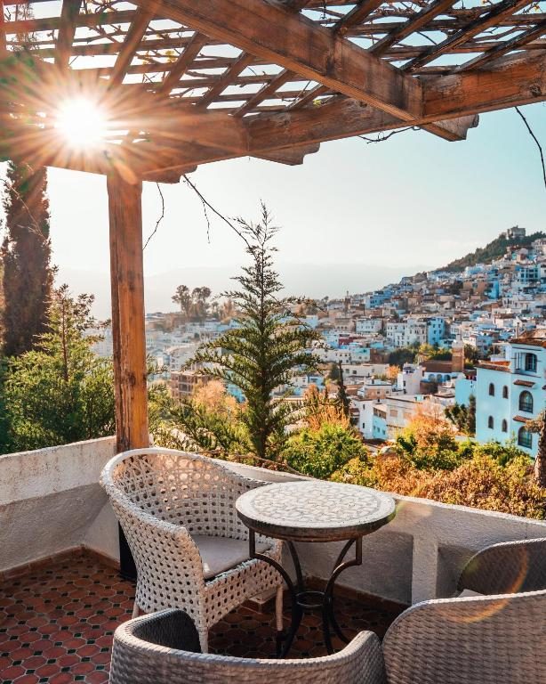 Dar Echchaouen terrace overlooking Chefchaouen's blue medina