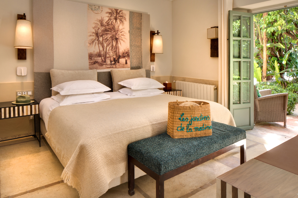 Garden Side bedroom opening directly onto dense greenery