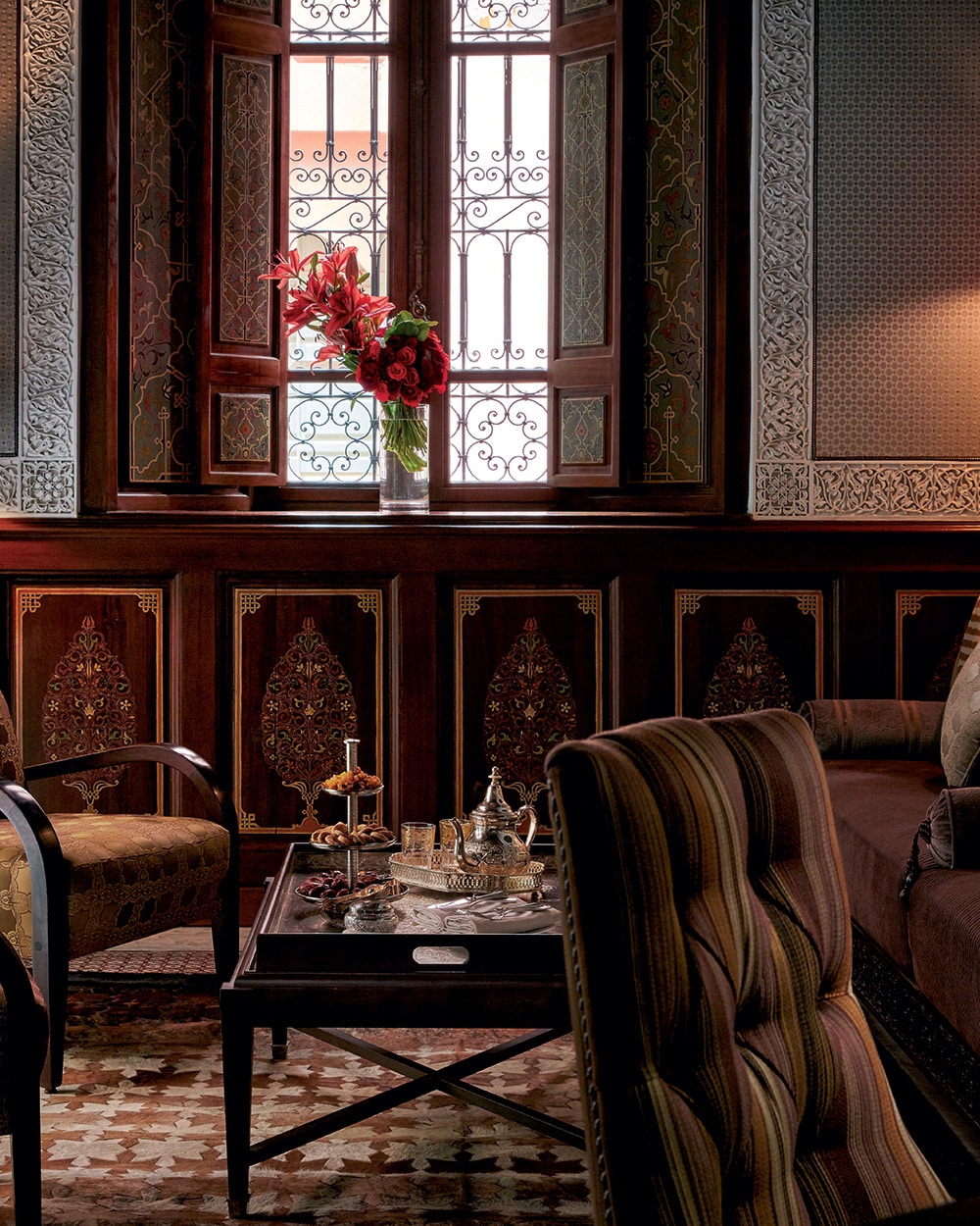 Private riad lounge with painted woodwork and Moroccan tea service