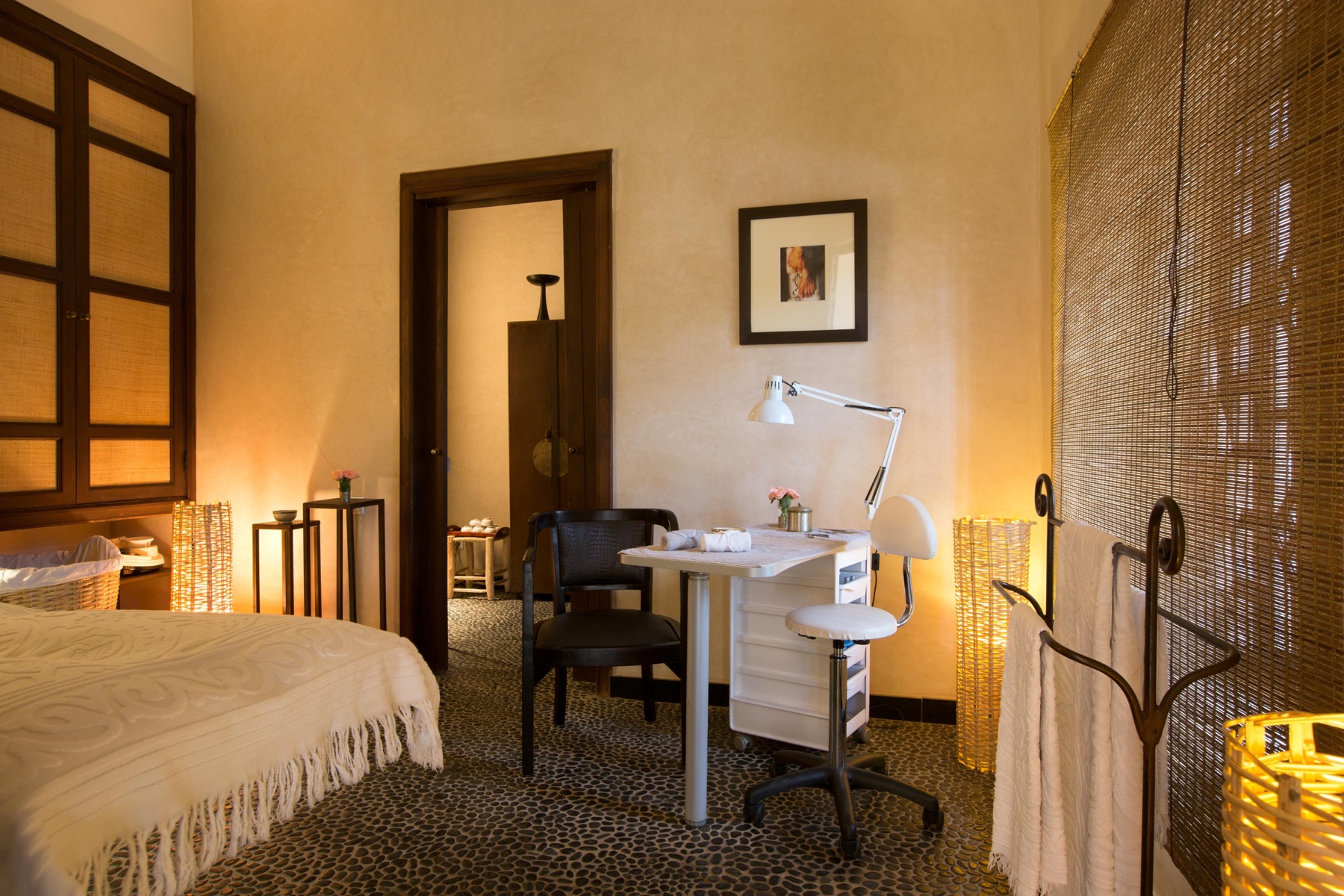 Spacious suite lounge with Moroccan arches and dark wood details